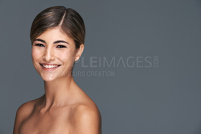 Buy stock photo Beauty, portrait and space with natural woman in studio isolated on blue background for wellness. Aesthetic, skincare and smile with confident young model on mockup for dermatology treatment