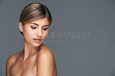 Buy stock photo Beauty, face and mockup with natural woman in studio isolated on grey background for wellness. Aesthetic, skincare and dermatology with confident young model on space for cosmetology treatment