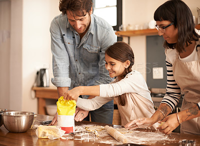 Buy stock photo Mother, father and girl with flour for cooking in kitchen with dough, happiness and teaching with support. Family, parents and child with helping, learning and bonding with baking for cake or cookies