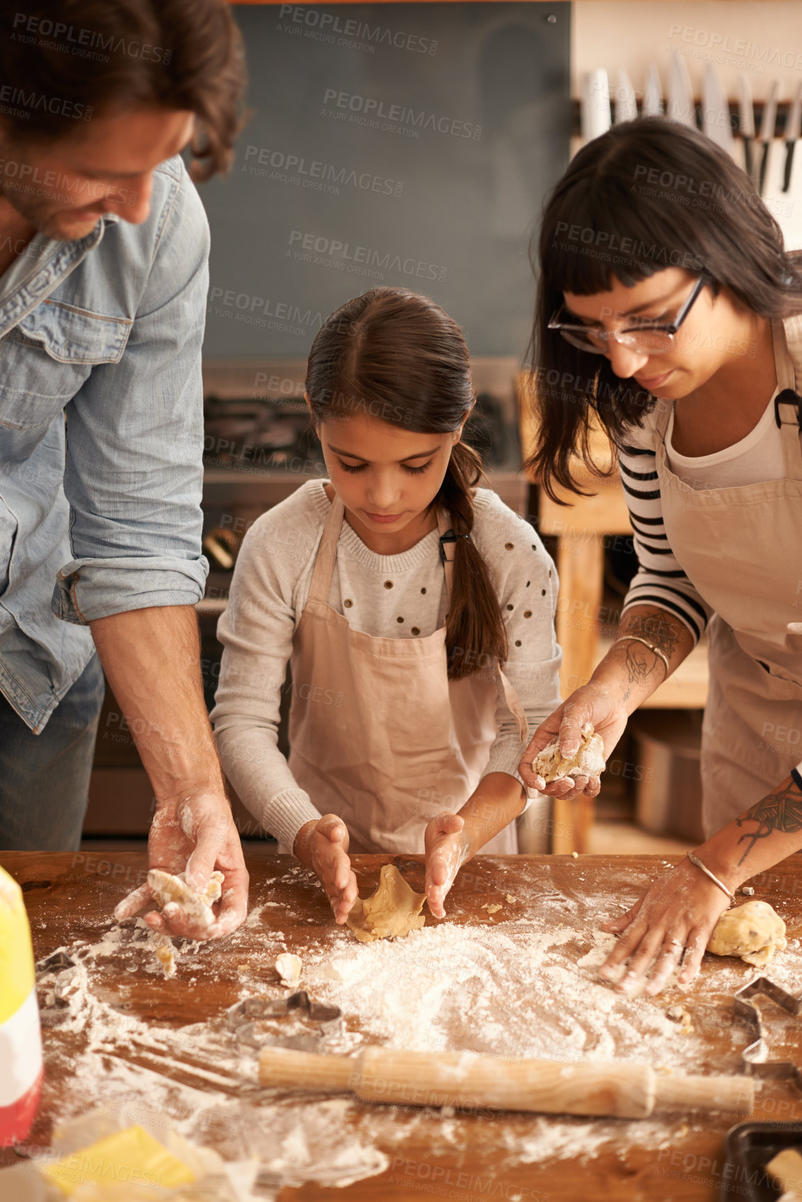 Buy stock photo Mother, father and girl with flour for baking cookies in kitchen with dough, rolling pin and teaching with support. Family, parents and child with helping, learning and bonding with cooking for hobby