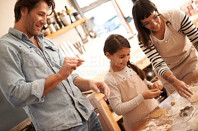 Buy stock photo Mother, father and girl with baking dough in kitchen with flour, happiness and teaching with support. Family, parents and child with helping, learning and bonding with cooking for hobby and snack