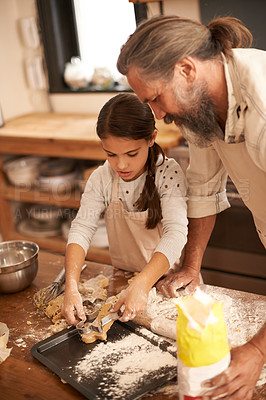 Buy stock photo Girl, child and grandfather with cooking in kitchen for cookies, baking and teaching with support or helping. Family, senior man or grandchild with biscuit preparation in home for bonding or learning
