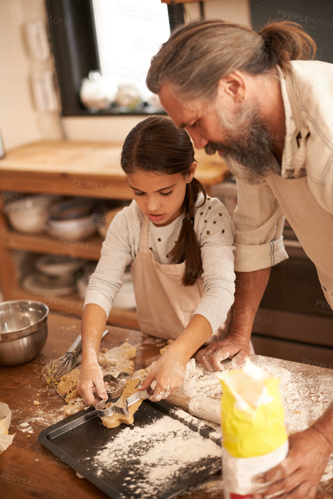 Buy stock photo Girl, child and grandfather with cooking in kitchen for cookies, baking and teaching with support or helping. Family, senior man or grandchild with biscuit preparation in home for bonding or learning