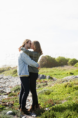 Buy stock photo Beach, outdoor and couple with love, kiss and smile with happiness and holiday for honeymoon. Romance, nature and man with woman or embrace with vacation or bonding together with adventure or date
