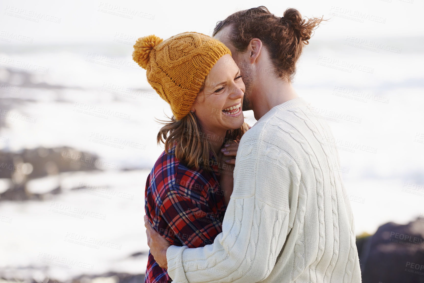 Buy stock photo Hug, beach and couple with love, date and happiness with weekend break, humor and vacation for honeymoon. Outdoor, romance or embrace with woman or man with sunshine or marriage with holiday or funny