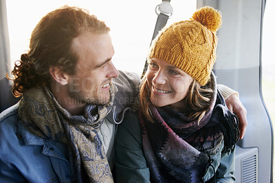 Buy stock photo Couple, hug and smile together in car, travel and bonding with road trip for date or anniversary. Love, trust and commitment with partner, loyalty and cuddle for warmth in winter, vacation and happy