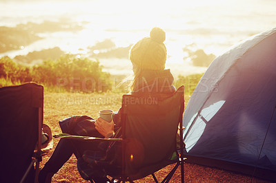 Buy stock photo Sunset, camping and woman by tent on vacation, adventure or holiday in nature for travel. Evening, coffee and back of female person relaxing and drinking cappuccino in chair outdoor for weekend trip.