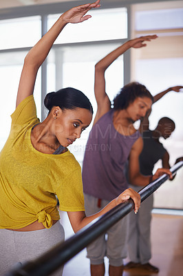 Buy stock photo Shot of a group of people practicing in a dance studio