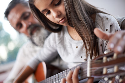 Buy stock photo Girl learning to play guitar, grandfather teaching child with music education and help with creativity. Musician, art and mature man helping female kid learn focus and skill on musical instrument