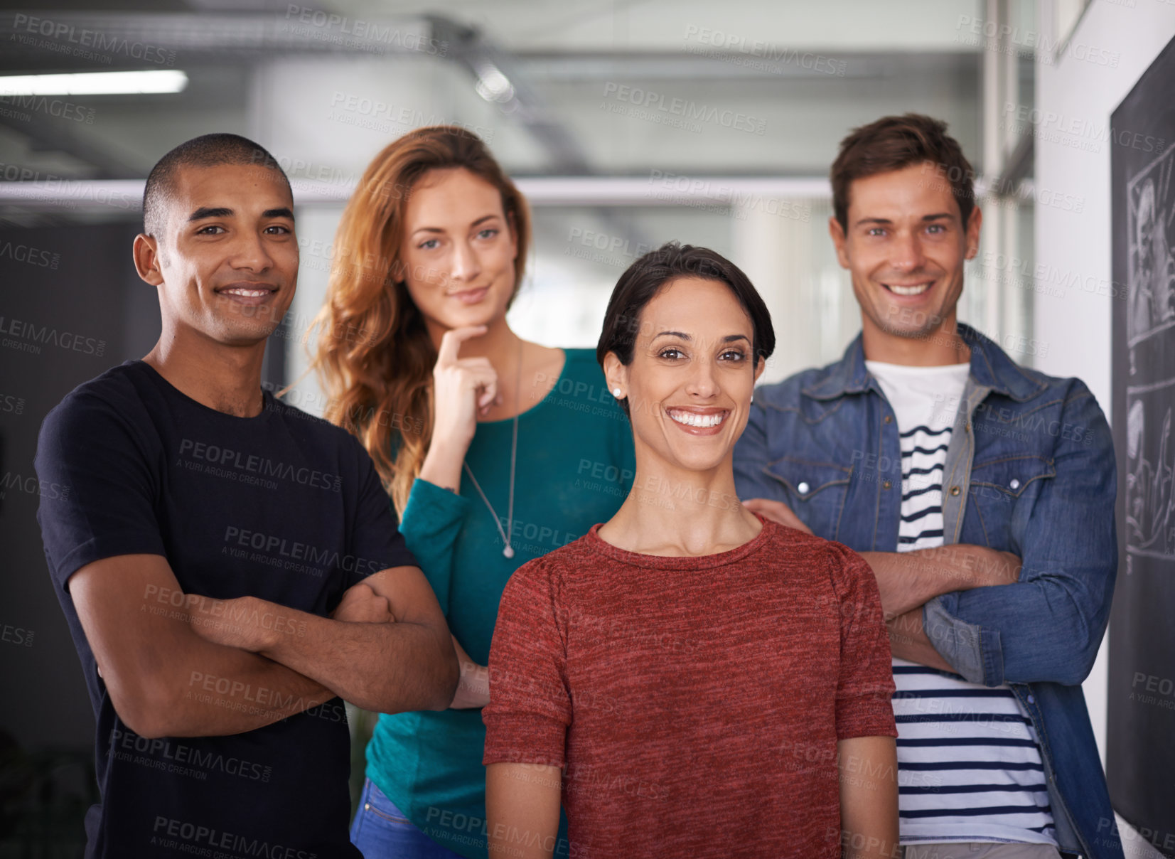 Buy stock photo Cropped portrait of a team of young creative professionals standing in the office