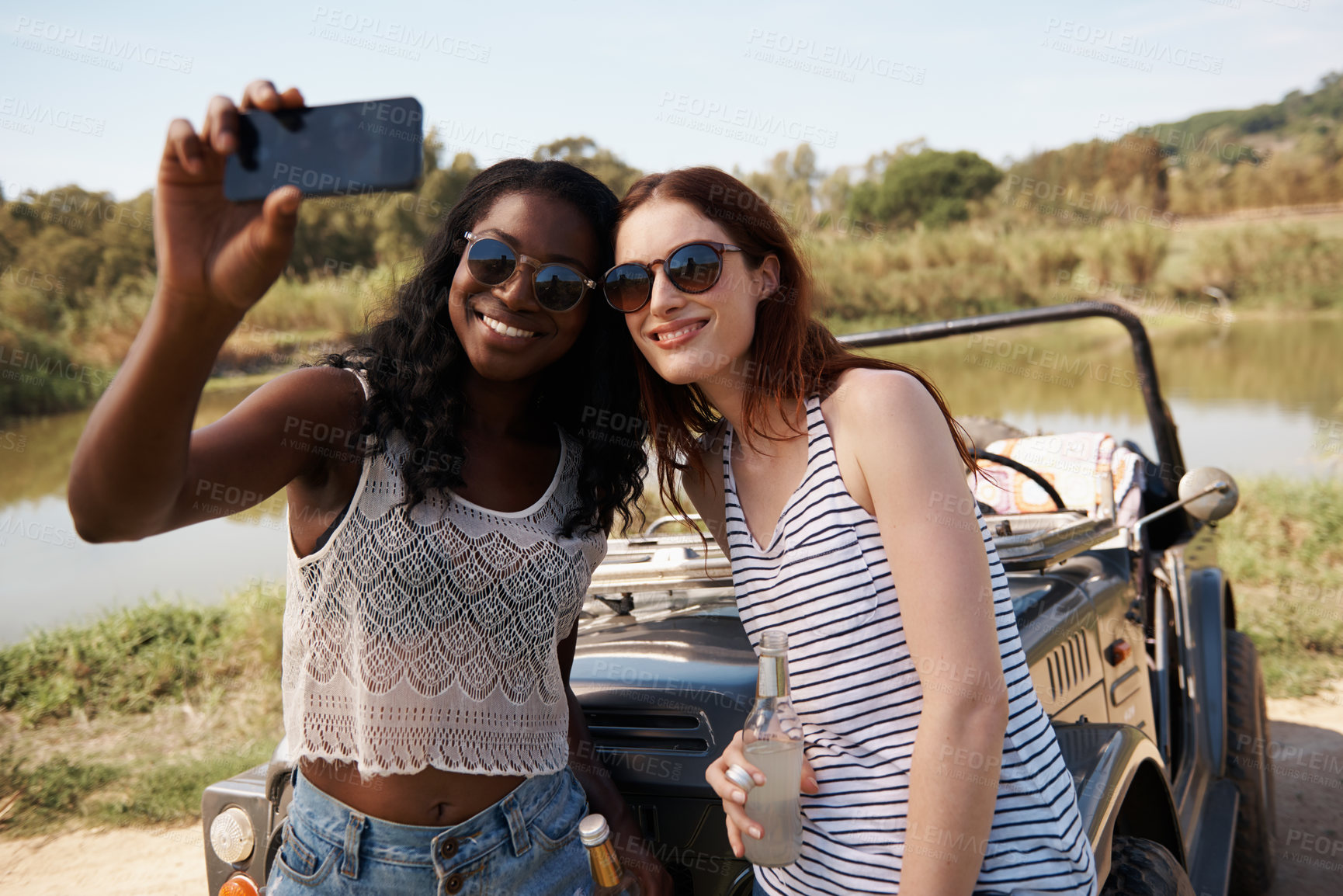 Buy stock photo Women, selfie and vacation on road trip by lake, memory and travel adventure for social media in nature. Ladies, cellphone and profile picture in van on holiday, care and bonding together outdoor