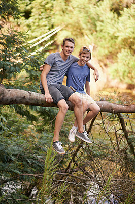 Buy stock photo Boys, portrait and friends in nature on tree trunk to explore wilderness, outdoor and activities on summer camp. Diversity, teenager and together to relax or climb on log in forest for adventure