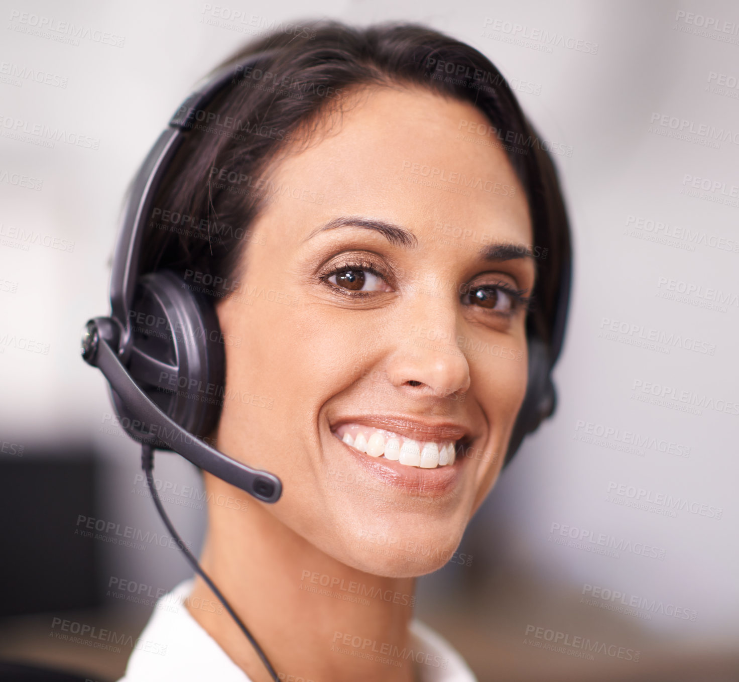 Buy stock photo Portrait of an attractive young office worker wearing a headset