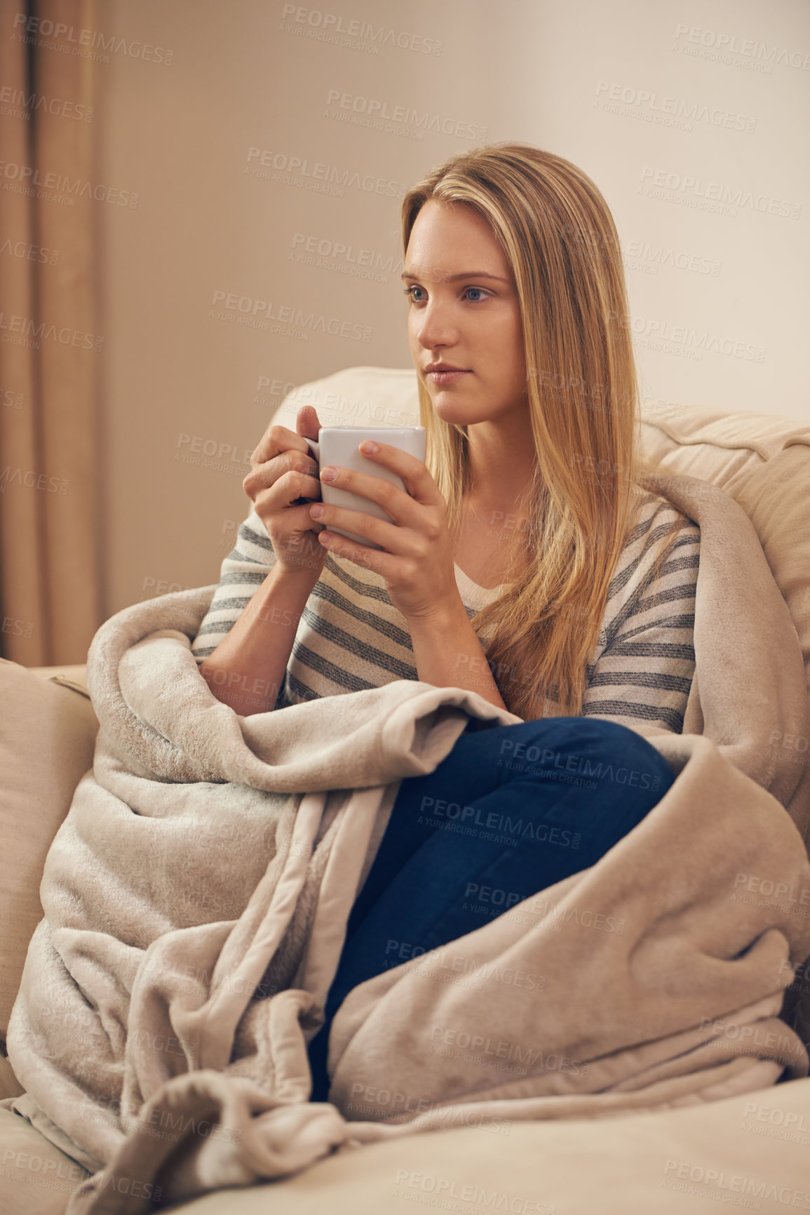 Buy stock photo Shot of an attractive young woman drinking a coffee at home