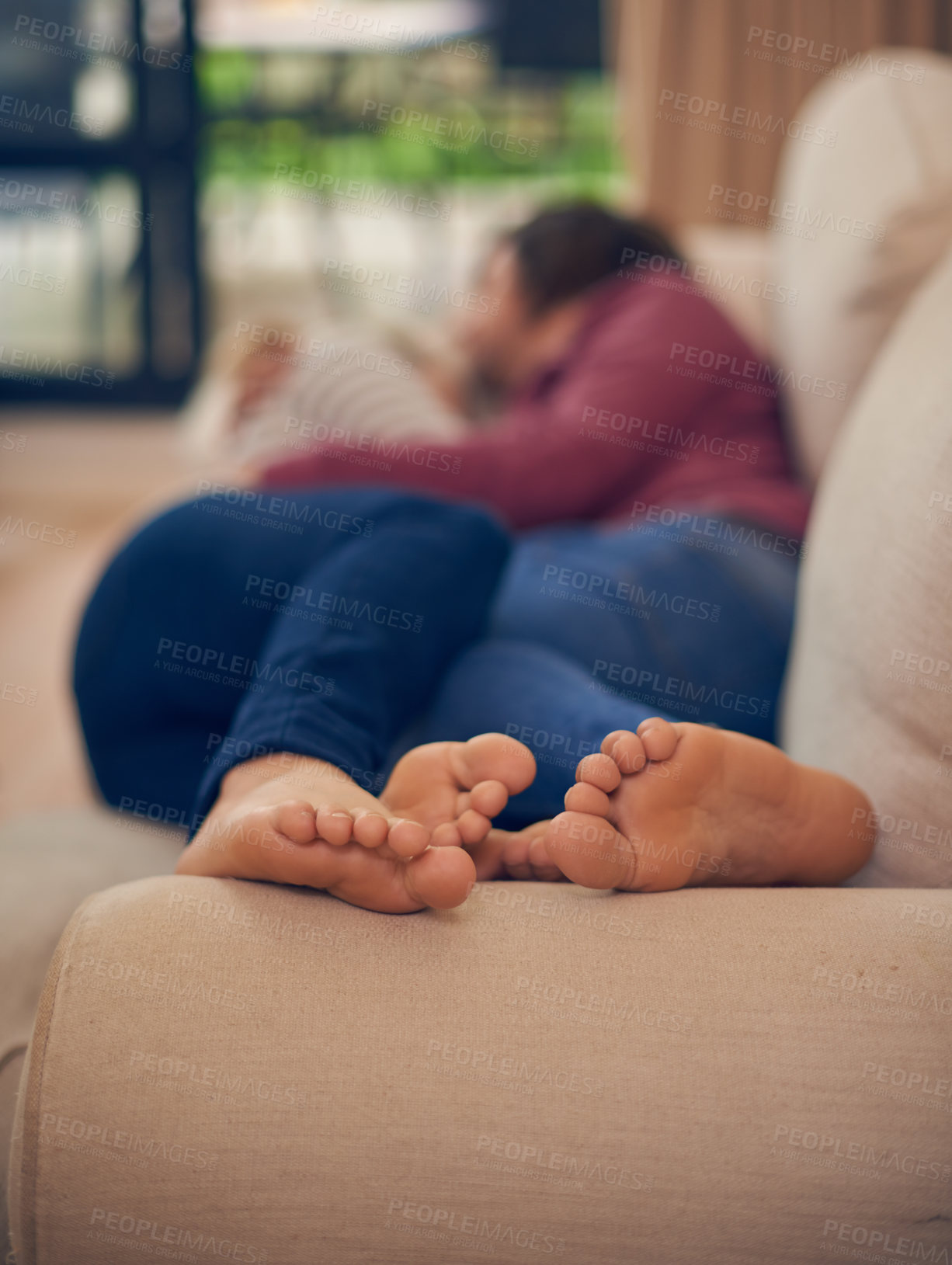 Buy stock photo A young couple napping together on the sofa