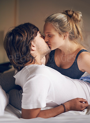 Buy stock photo Love, kiss and couple on a bed with care, trust and support, security and bonding in their home together. Morning, romance and people embrace in a bedroom with intimacy, moment or fun in their house