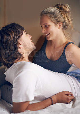 Buy stock photo Relax, love and couple in a bed talking, bonding and resting in their home from together. Wake up, conversation and people in a bedroom with morning speaking, chat or chilling in a house on weekend
