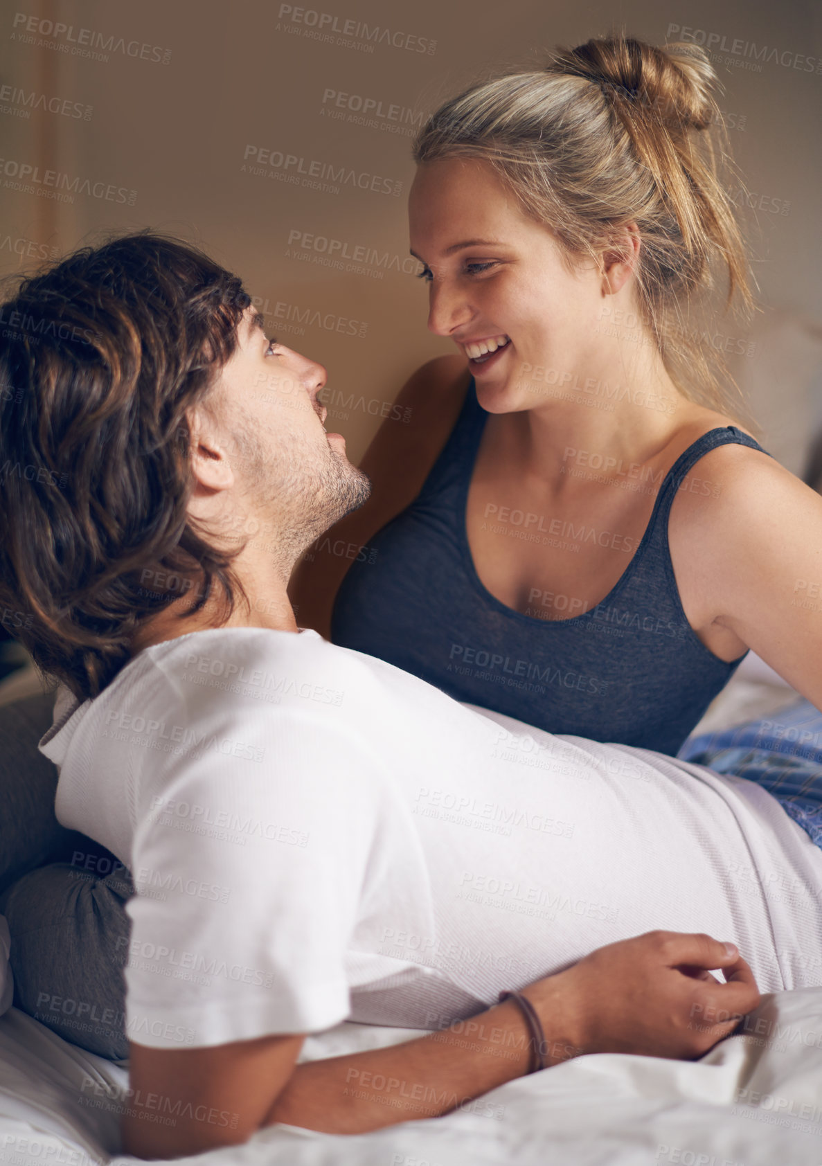 Buy stock photo Relax, love and couple in a bed talking, bonding and resting in their home from together. Wake up, conversation and people in a bedroom with morning speaking, chat or chilling in a house on weekend