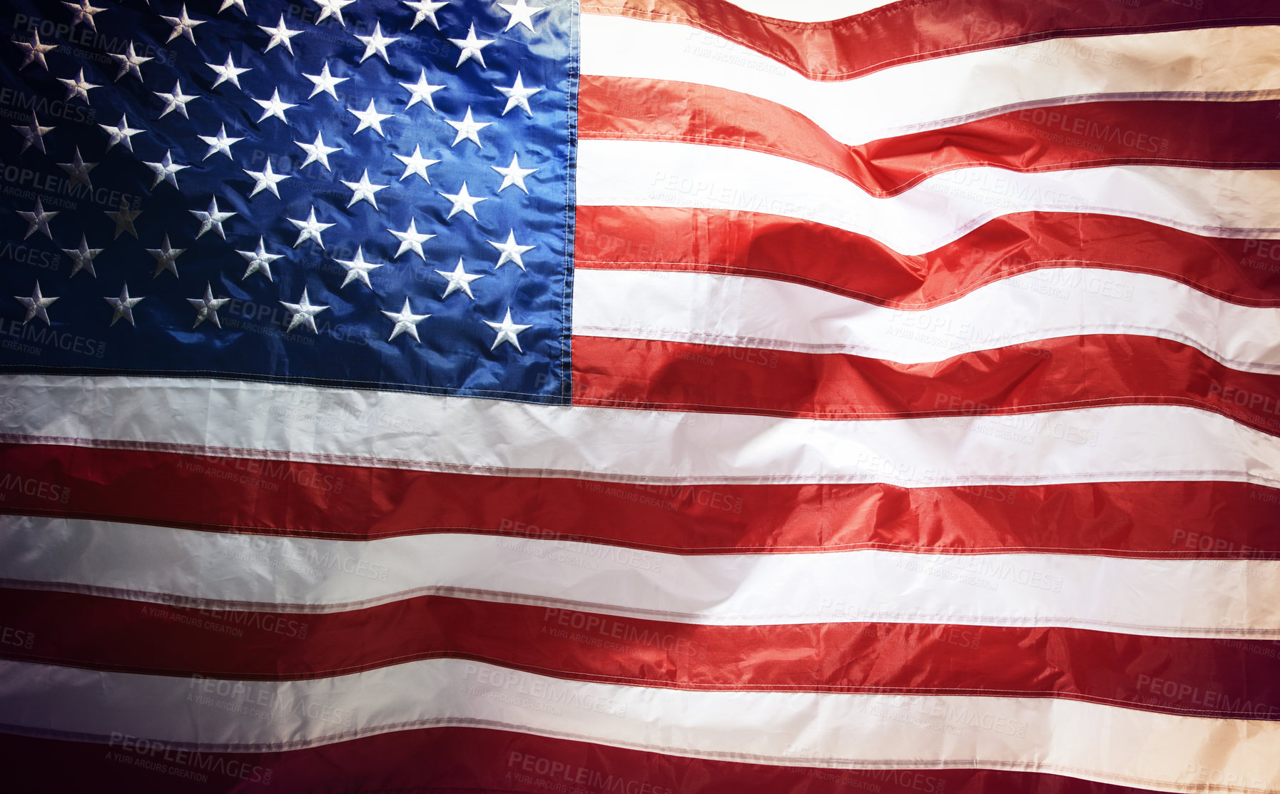 Buy stock photo Closeup of the american flag blowing in the wind. Freedom and patriotism for the american people. Celebrating independence on the fourth of July. The stars and stripes show pride in your country