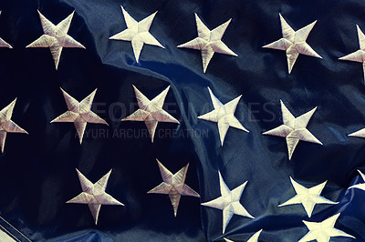 Buy stock photo Closeup of the blue side of the american flag blowing in the wind. Freedom and patriotism for the american people. Celebrating independence on the fourth of July. The stars show pride in your country