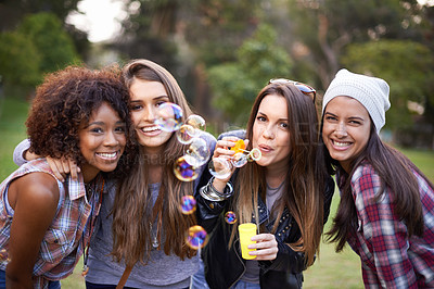 Buy stock photo Friends, bubbles and portrait of women in nature for bonding, smile and happiness outdoors. Happy, fashion and gen z with people with soap bubble in park for weekend, holiday and vacation together