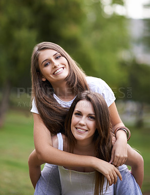 Buy stock photo Girl friends, smile and portrait with piggyback in park with bonding and fun on campus outdoor. Students, grass and happy together in a university garden on a break for summer holiday in nature