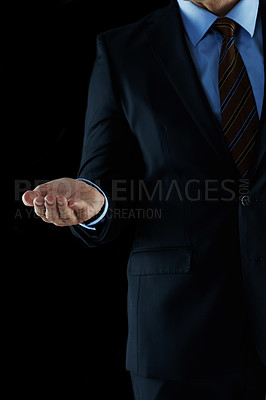 Buy stock photo Shot of an unrecognizable businessman holding out his hand