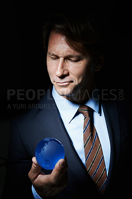 Buy stock photo Man, suit and orb in studio for globe or earth for communication and connectivity in business. Leader or ceo with sphere, crystal or circle in hand for economy, world or future for corporate  
