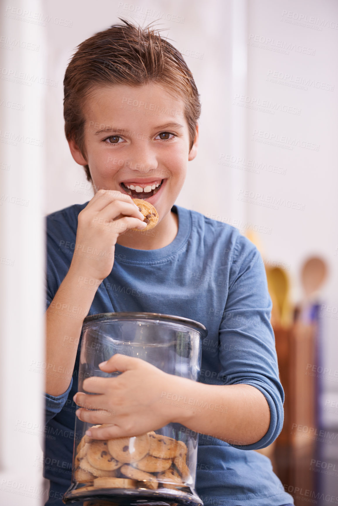 Buy stock photo Eating, cookies and portrait of child in home with glass, container or happy with jar of sweets in kitchen. House, snack and craving taste of sugar from addiction to unhealthy food or biscuit