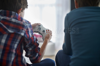 Buy stock photo Boys playing video game, controller and friends gaming with technology, esports and entertainment with back view. Gamer kids play games on console at home, youth and  male children have fun together