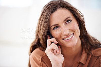 Buy stock photo Cropped shot of an attractive woman talking on a mobile phone