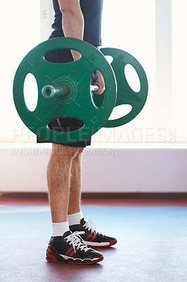 Buy stock photo Man, shoes and hands weightlifting in a gym with athlete wellness and healthy from workout. Fitness, bodybuilder and male person with weights power from strong arm muscle and training at health club