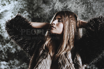 Buy stock photo Shot of a beautiful woman posing against a wintery background