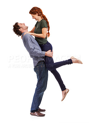 Buy stock photo Couple, happy and lifting embrace in studio for marriage celebration or bonding connection, love or white background. Man, woman and relationship fun for playful boyfriend, laughing or mockup space