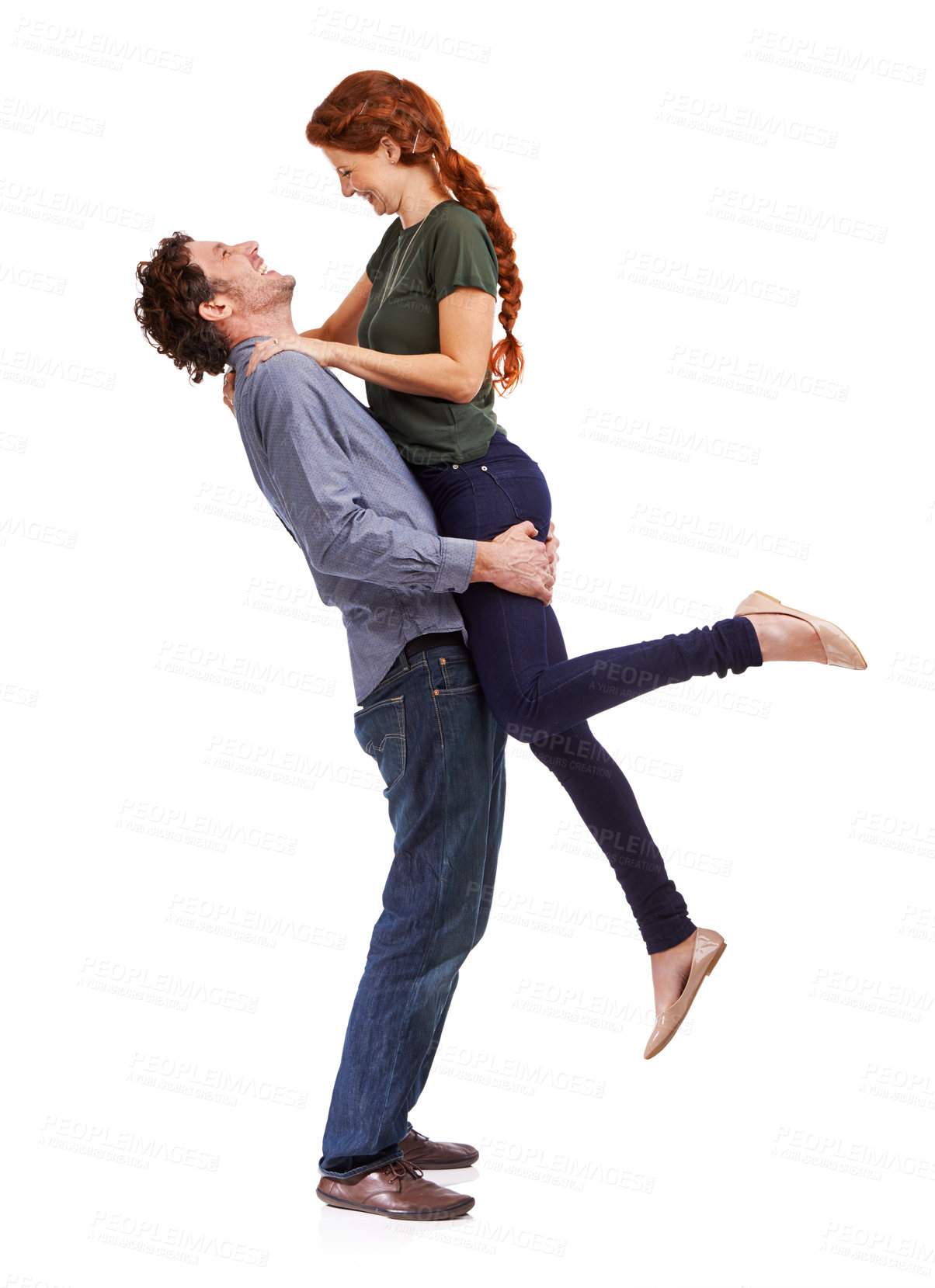 Buy stock photo Couple, happy and lifting embrace in studio for marriage celebration or bonding connection, love or white background. Man, woman and relationship fun for playful boyfriend, laughing or mockup space