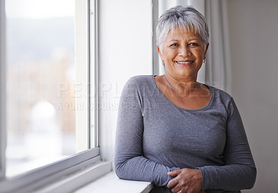 Buy stock photo Portrait, smile and window with senior woman, happiness and sunshine with weekend break and casual outfit. Face, pensioner and elderly lady with summer and retirement with old age, home and joyful