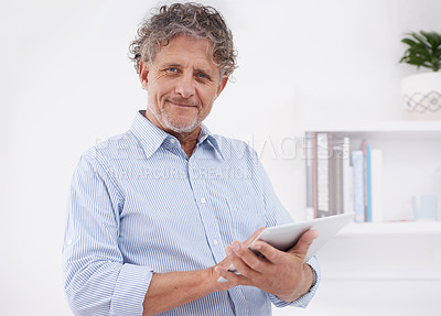 Buy stock photo Man, smile and office with tablet for research, internet and online with technology for business or job. Executive with tech and finger on screen for app or website for profession or work indoor