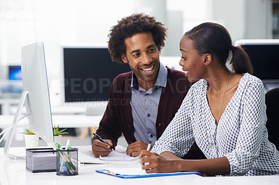 Buy stock photo Shot of two colleagues sitting in an office