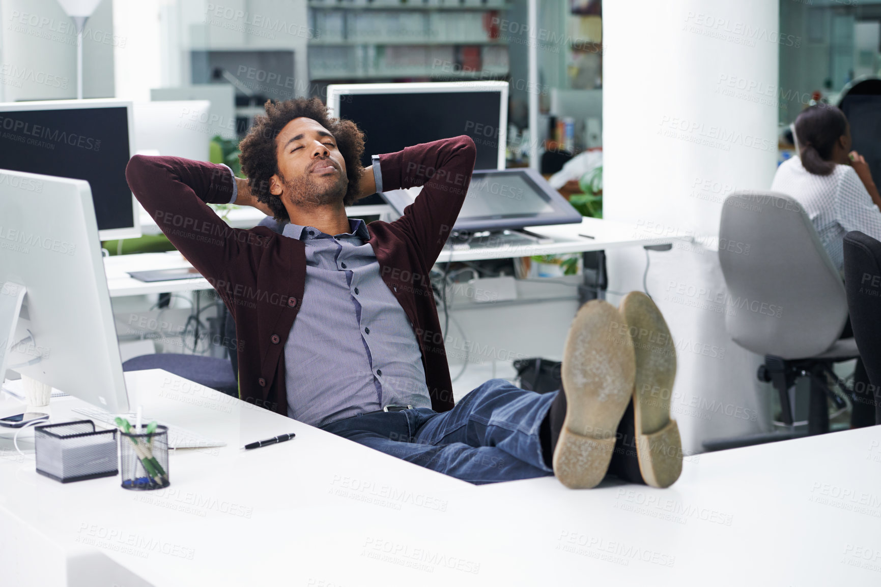 Buy stock photo Break, relax or sleep with business man at desk in office, feet up for finished project and task. Computer, eyes closed and rest with confident young employee in workplace for complete or done work