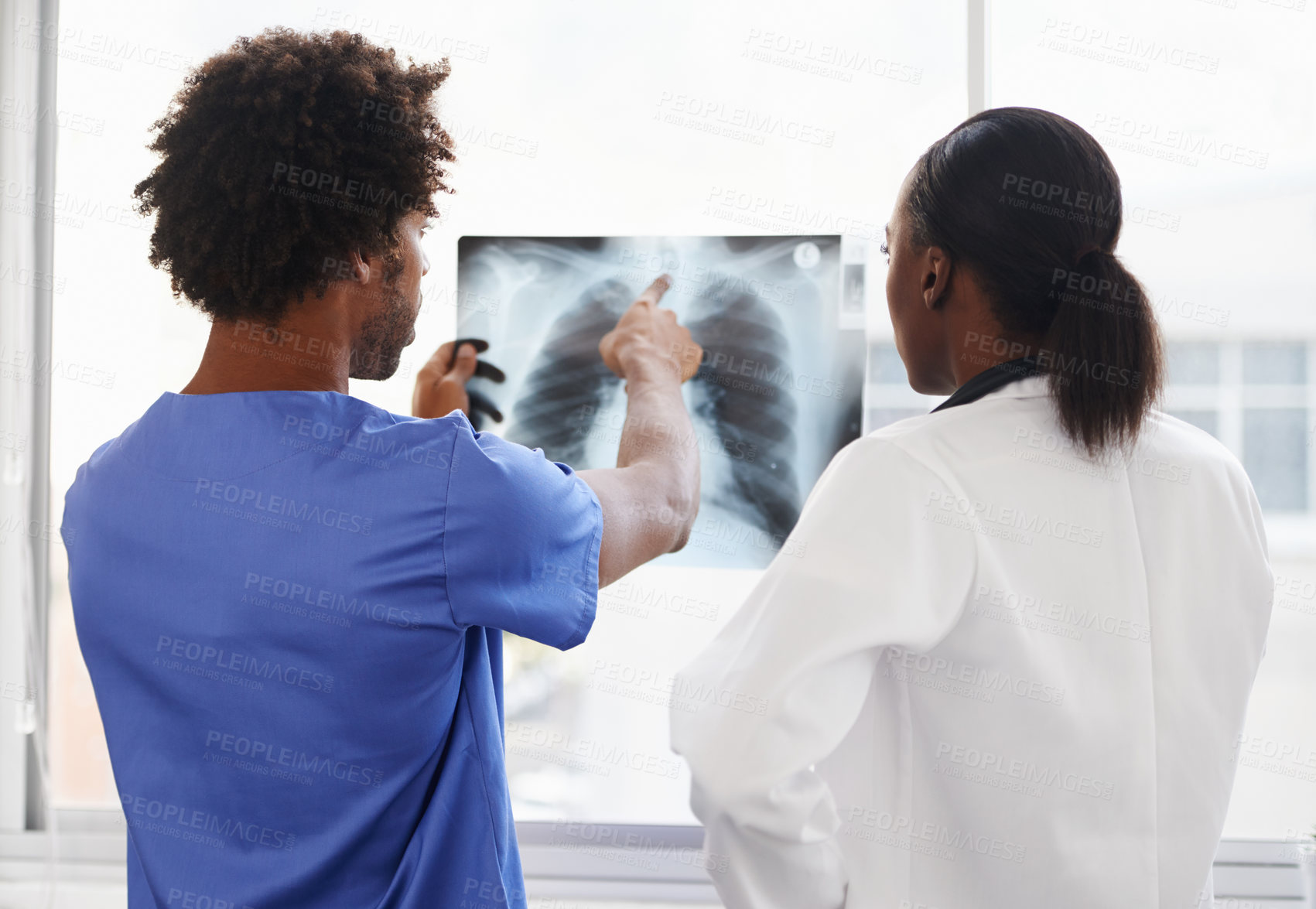 Buy stock photo Doctor, nurse and review xray for healthcare, collaboration for surgery and treatment plan with cardiology. Black people study lung scan, MRI or radiology, medicine and surgeon with team at hospital