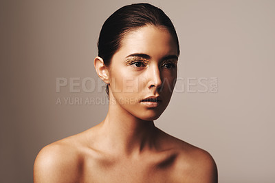 Buy stock photo Woman, makeup and gold sparkle on eyes for beauty, cosmetology and glamour with cosmetics on beige background. Eyeshadow, glitter and fashion model in studio, art or creativity with shimmer and glow