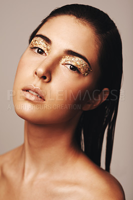 Buy stock photo Portrait of an attractive brunette with golden flakes around her eyes