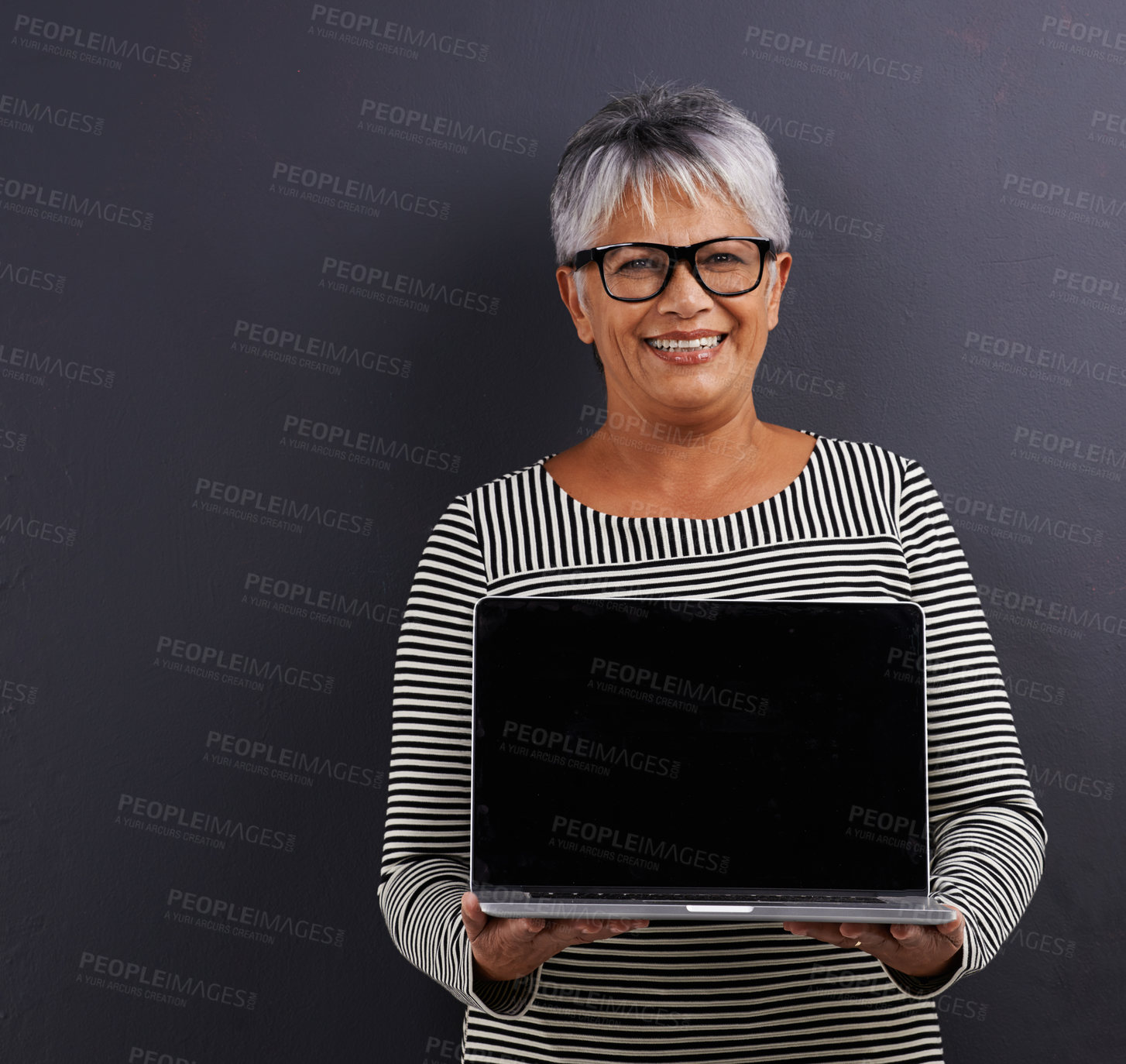 Buy stock photo Laptop, screen and portrait of mature woman in studio background learning about technology in mockup. Senior, person and advertising education on computer for communication, connection and networking