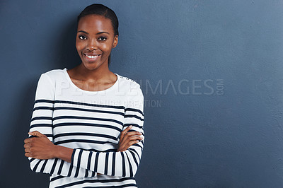 Buy stock photo Portrait, smile and black woman with arms crossed, fashion and model on a blue studio background. Face, African person and girl with casual outfit and stylish clothes with confidence and mockup space