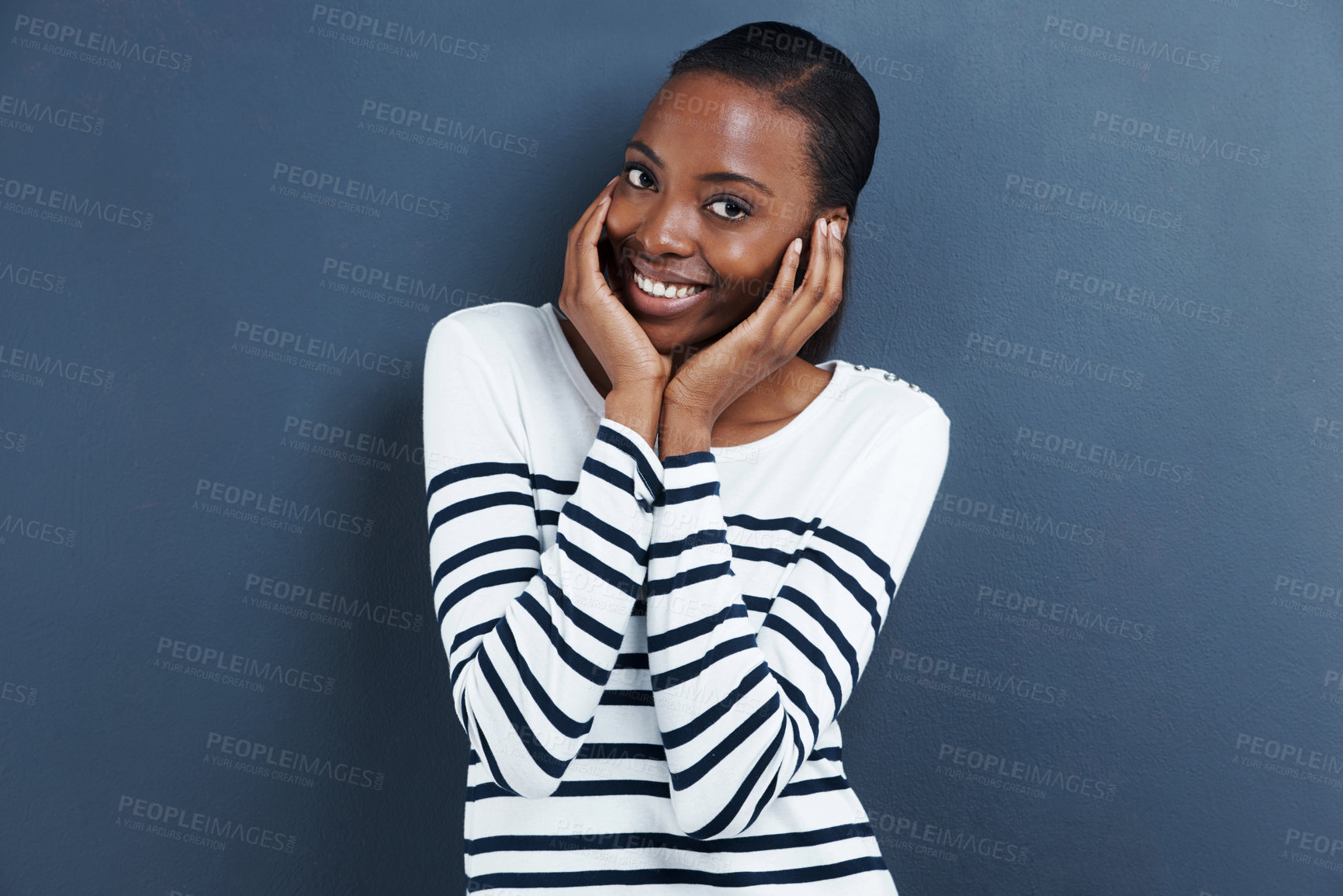 Buy stock photo Portrait, smile and black woman with reaction, shy and expression on a grey studio background. Face, person and model with social anxiety and embarrassed with mockup space and happy girl with emoji