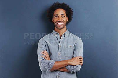 Buy stock photo Portrait, smile and black man with arms crossed, fashion and afro on a blue studio background. Face, African person and model with casual outfit and stylish clothes with confidence and mockup space