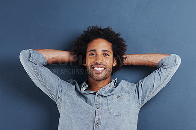 Buy stock photo Portrait, smile and black man with happiness, relaxing and confident guy on a grey studio background. Face, African person and model with a shirt and fashion with mockup space and afro with style
