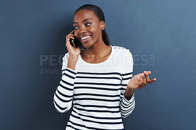 Buy stock photo Black woman, phone call and happy in studio for networking, chat and gossip by blue background. African student, talking and cellphone for connection with social network and news or update on holiday