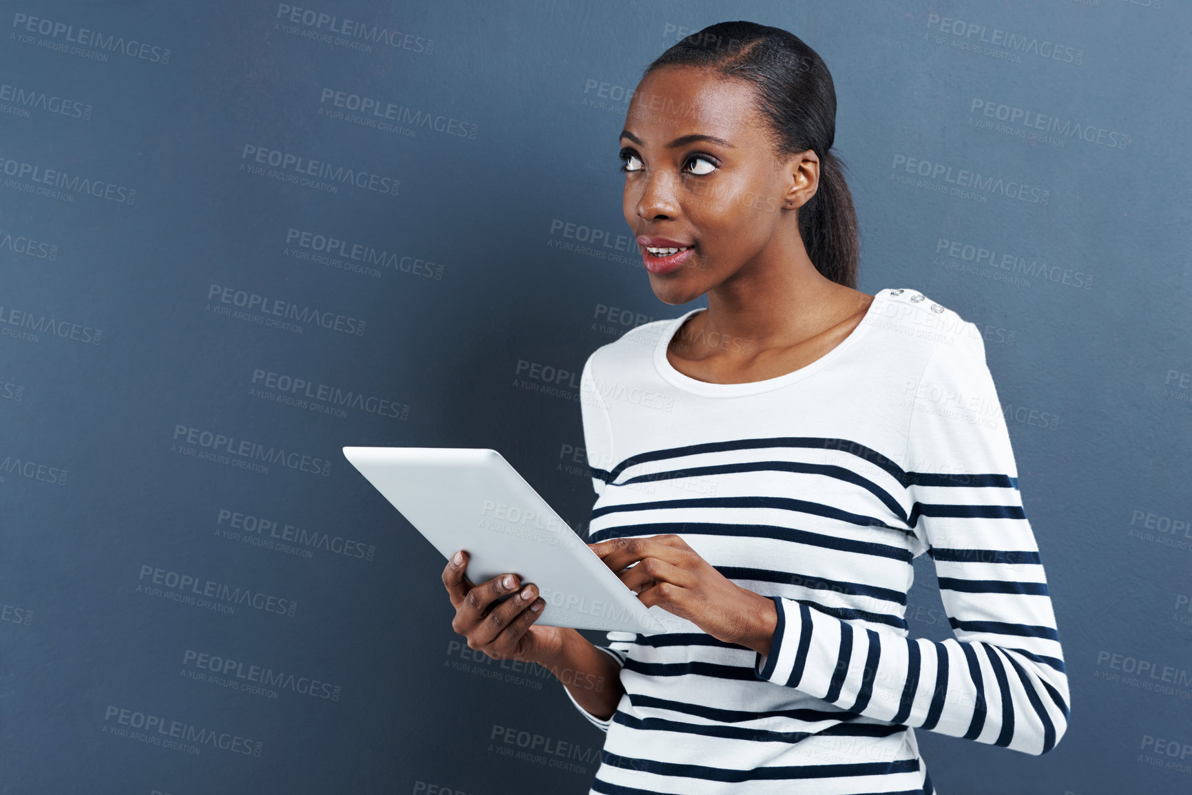 Buy stock photo Black woman, tablet and thinking about ideas for research, internet and social media with influencer on blue background. Digital, touchscreen and brainstorming for content creation with inspiration