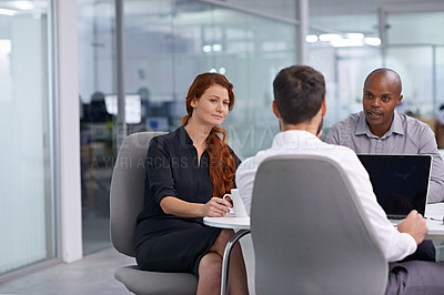 Buy stock photo A group of coworkers having a meeting in an office